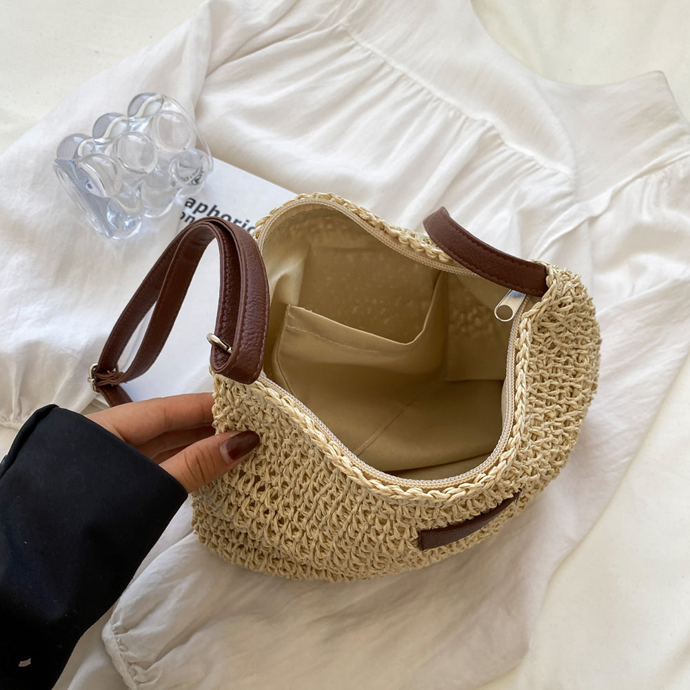 Bolso de mano de paja de diseño exclusivo para vacaciones.